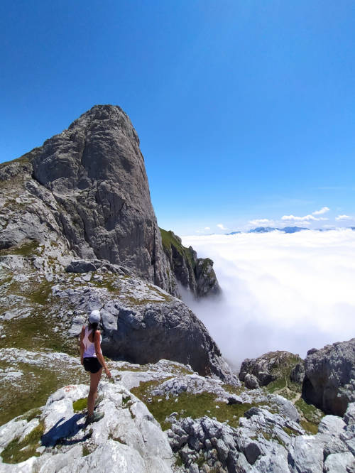 Hiker above the clouds in Picos de Europa